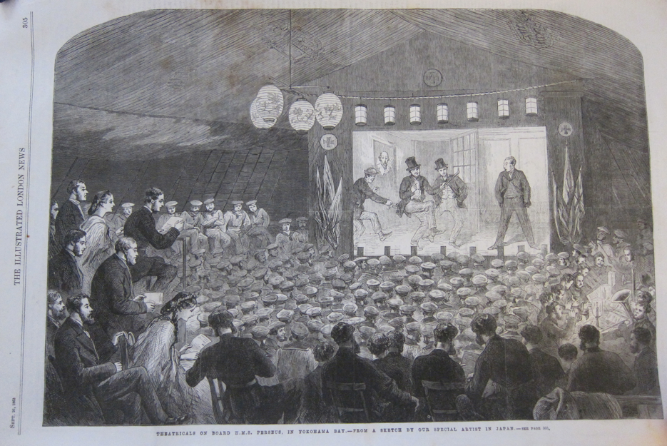 A performance on the upper deck of HMS Perseus. Sailors on a makeshift stage performing for a crowd of bluejackets, invited guests, and officers.